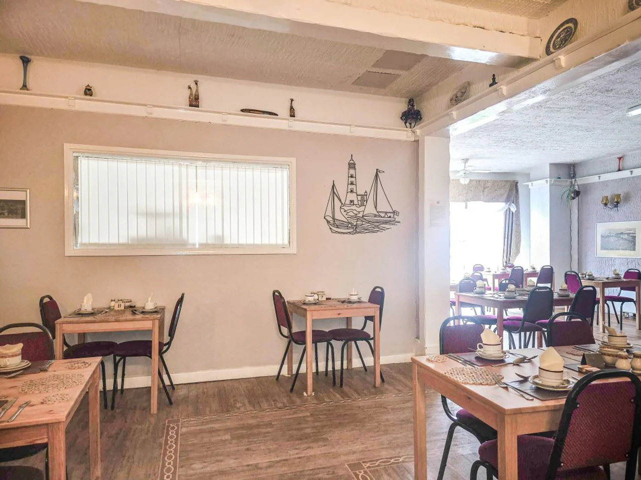 A quieter corner of the breakfast room at The Manuela Rose
