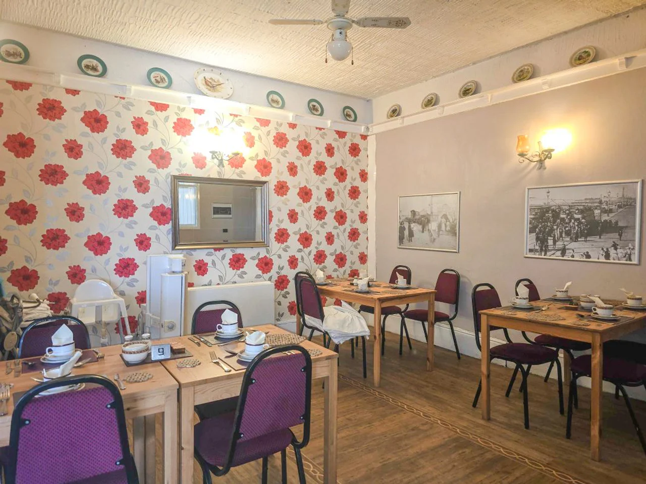The breakfast room at The Manuela Rose with tables set for guests